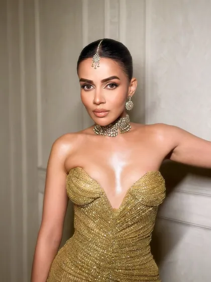 Dripped in gold. A stunning portrait of Komal in a metallic gold dress, with makeup to match.
