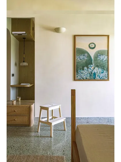 We used reclaimed terrazzo flooring and custom wooden furniture in this bedroom from Apartment 5026. The design pays homage to the building's Art Deco history while feeling fresh and contemporary, showcasing our ability to blend old and new.