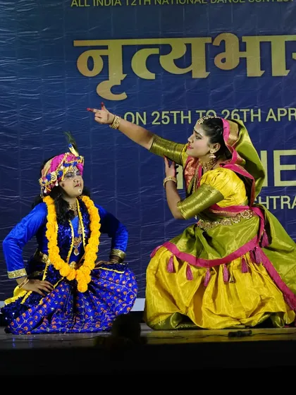 A moment of interaction between two characters in "PREMA VINOD." The performance is not just about steps but also about acting and conveying a story.