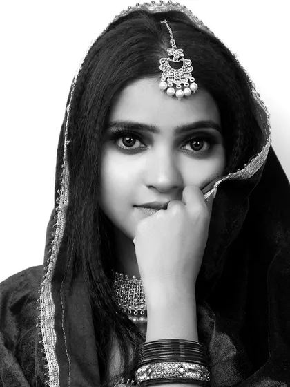 A powerful black and white portrait for a model's portfolio. This type of headshot is essential for showcasing a model's features and versatility for different casting opportunities.