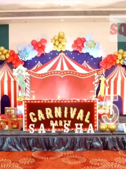 Step right up to this amazing Carnival themed birthday party. I created a full stage experience with a red and white striped circus tent backdrop, a Ferris wheel prop, a popcorn stand cutout, and vibrant marquee letters.