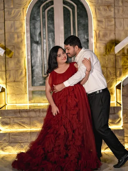 A tender moment on the stone staircase, with the warm lighting creating an intimate and romantic mood.