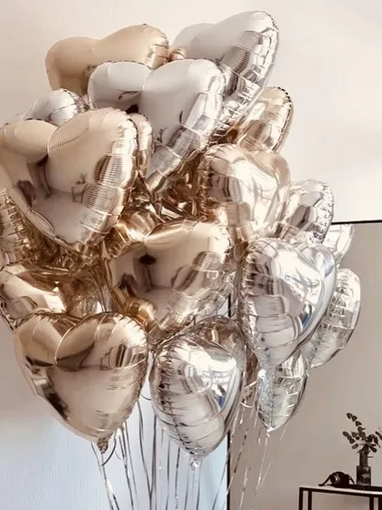 A beautiful bouquet of heart-shaped foil balloons in a mix of rose gold and silver. A perfect gift for an anniversary, Valentine's Day, or just to show some love.