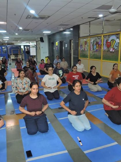A moment of calm and concentration as our staff practices breathing exercises during the International Yoga Day event.