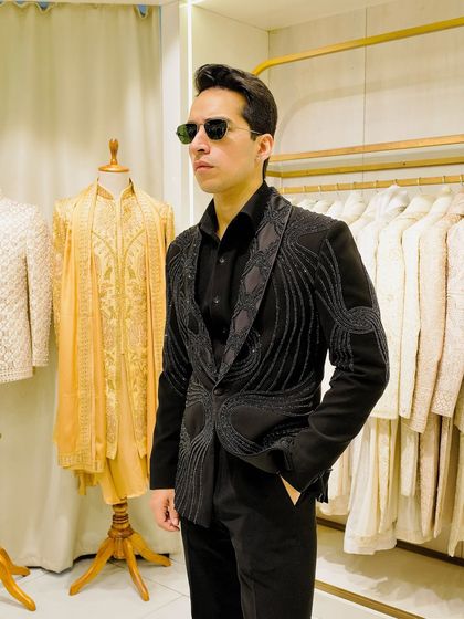 This is where bling meets class. A full look at our black blazer with abstract wave-like beadwork, paired with a simple black shirt to let the jacket be the hero.