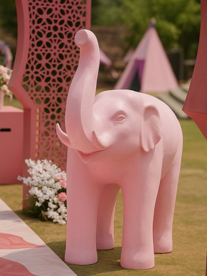 Adding a touch of local charm and whimsy to a Jaipur Mehendi with this adorable pink elephant statue. These fun props are placed along the entrance to delight guests and enhance the playful theme.