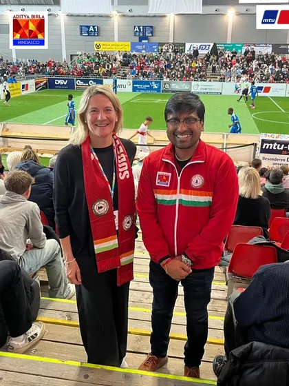 Building international friendships. Mr. Gupta with an international guest at the MTU Cup, both wearing Sudeva scarves.