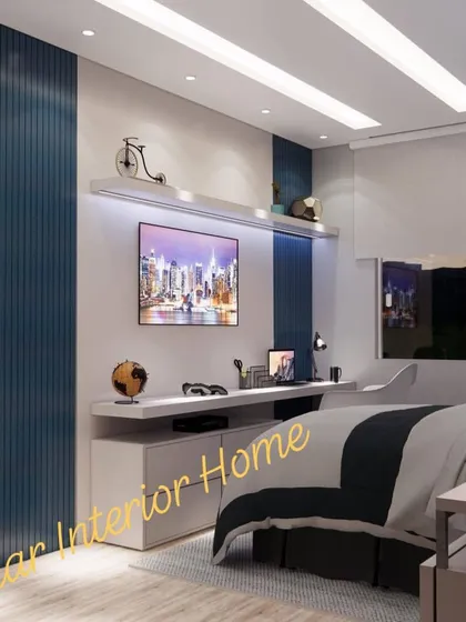 The study desk is integrated with the TV unit, creating a long, functional surface. The fluted blue panel adds a pop of color and texture.