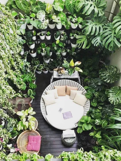 This inspirational image shows the potential of a small balcony to become a private urban jungle. With vertical gardening and smart plant choices, we can help you create a cozy, green nook for relaxation, no matter the size of your space.