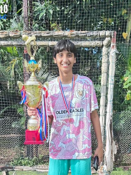 A close-up of one of our victorious U15 girls with her trophy. The joy of winning is a powerful motivator.
