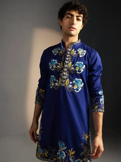 A royal blue kurta with hand-painted and embroidered floral motifs.