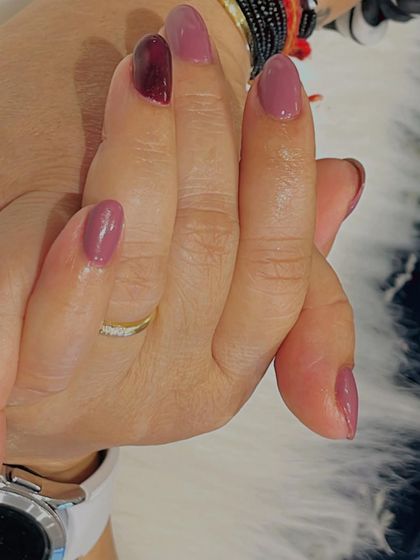 A lovely combination of mauve and deep berry tones. This manicure plays with different shades within the same color family for a subtle yet interesting look.