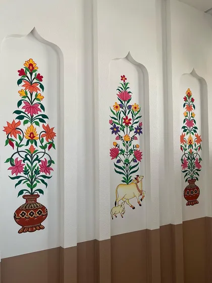 A closer look at the three Kalamkari panels, each with a unique floral design.