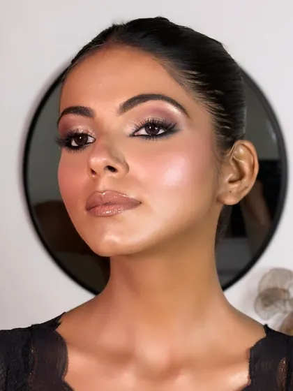 Another angle of this soft glam look. Notice the beautiful highlight on the cheekbones that gives the skin a healthy glow without emphasizing texture.