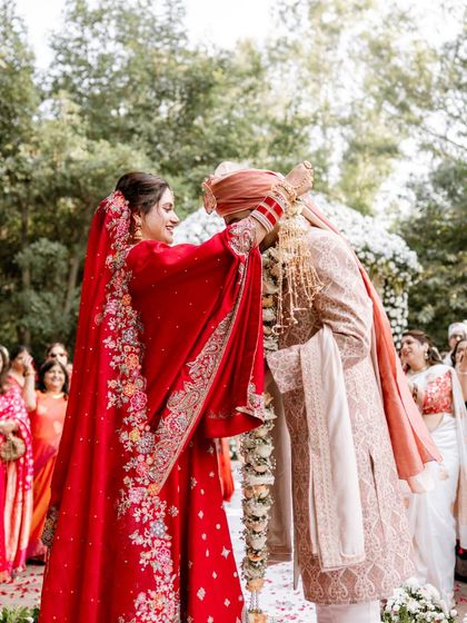 A precious moment from Yogita's wedding ceremony. Even from a distance, her radiant makeup look stands out, proving that a natural approach can be just as impactful.