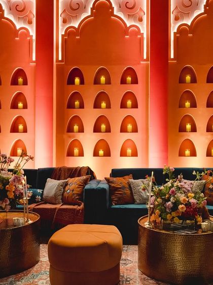For a Sufi night in Bangalore, we created 'Midnight Marrakesh'. This seating area features a fresh color palette of tangerine and blues, with gleaming structures inspired by Moroccan and Indian architecture.