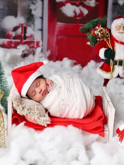 This wide-angle shot captures the entire magical Christmas village I created in the studio for this newborn session.