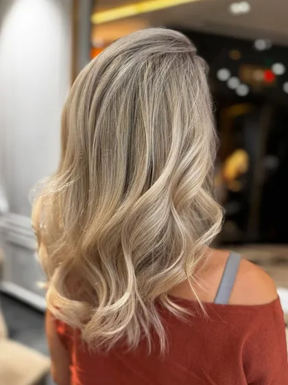 Another view of these stunning platinum highlights, styled into soft waves.