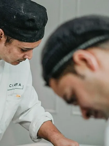 Our chefs working with intense focus. The job requires passion, attention to detail, and a deep respect for ingredients. We salute our entire kitchen team.