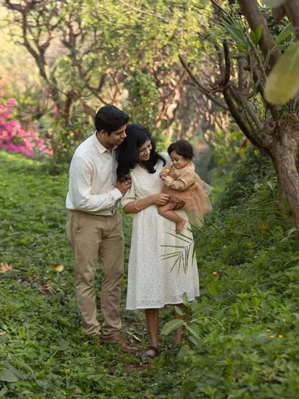An outdoor family session in a beautiful, lush garden. I love using natural settings to create a warm and relaxed atmosphere, allowing your family's connection to be the focus.