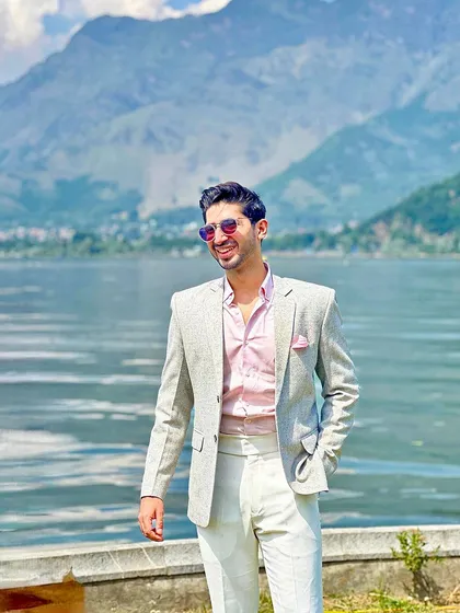 A happy client enjoying the moment in his perfectly tailored summer suit.