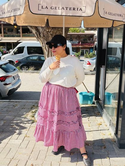 Enjoying a sweet treat while wearing the black studded ballet flats. This image perfectly captures the everyday wearability of my designs, proving that you don’t have to sacrifice style for comfort.
