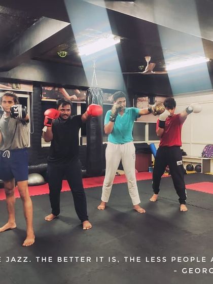 As the quote says, "Boxing is like jazz. The better it is, the less people appreciate it." Here's a group of students practicing their form, creating their own rhythm.