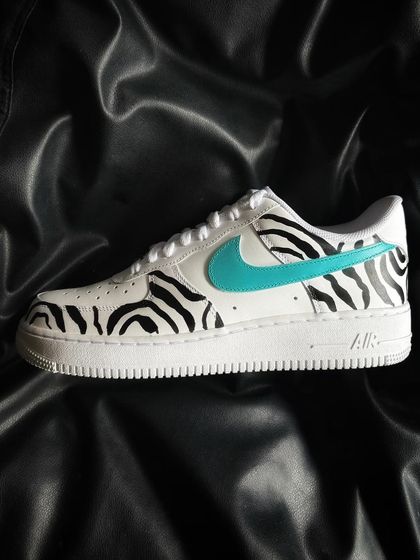 A side profile of the zebra stripe custom sneaker.