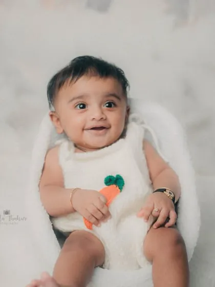 A happy baby in a sea of fluffiness. This milestone session was all about capturing pure, simple joy.