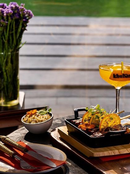 A glimpse of our spectacular summer delights. This shot features our delicious skewers served alongside a refreshing cocktail, perfect for enjoying a sunny afternoon lunch at Khubani.