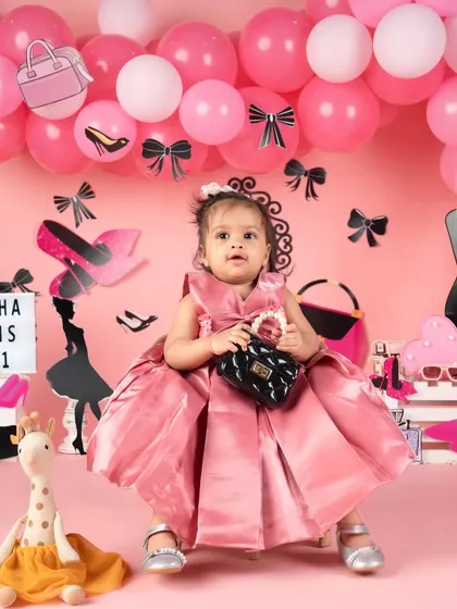A different take on the fashion theme, this princess is wearing a beautiful satin pink gown.