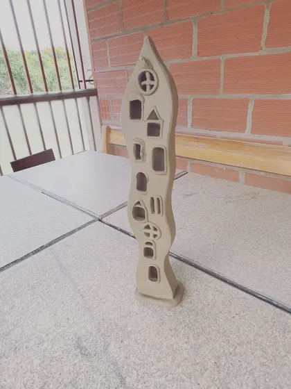 Another view of my wavy lamp sculpture, standing on a table in my studio.