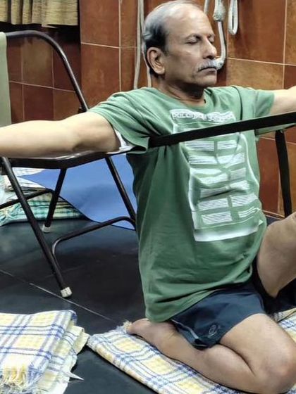 A seated leg stretch with a strap.