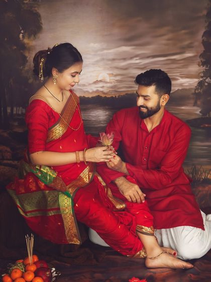 A moment of gentle offering and connection. In this Maharashtrian-themed shoot, the husband gives his wife a lotus flower, a beautiful symbol of purity and love.