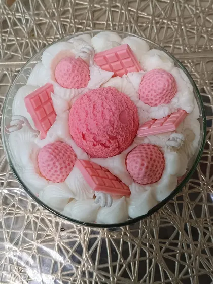 An overhead view of the large ice cream bowl candle, showing the arrangement of all the wax toppings.