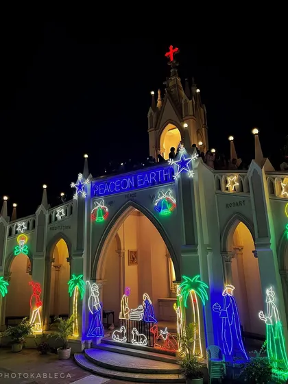 Another perspective of the church entrance, highlighting the neon-style light decorations.
