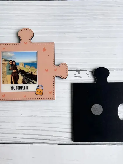 This image shows one half of the couple's puzzle magnet, highlighting the magnet on the back and the sublimation printing on the MDF material.