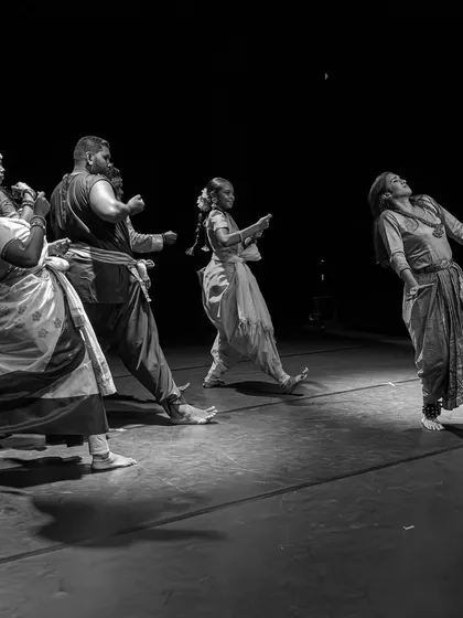 A dramatic black and white shot from our performance in Réunion Island, France. This image captures the raw emotion and physical storytelling that defines "The Wheel of Choices."