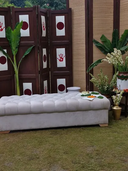 A simple and elegant seating area for a daytime function, using a neutral color palette and natural materials.