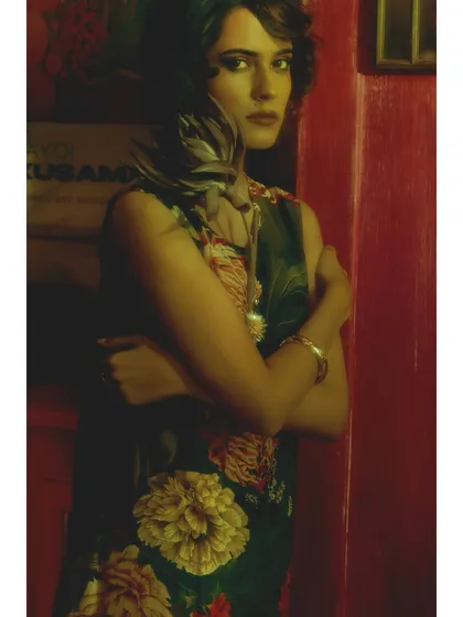 From 'Chapter 2: Room of Memories'. The styling remains rooted in florals, but the model's pose is more guarded. She is surrounded by the past, a prisoner of her own memories.