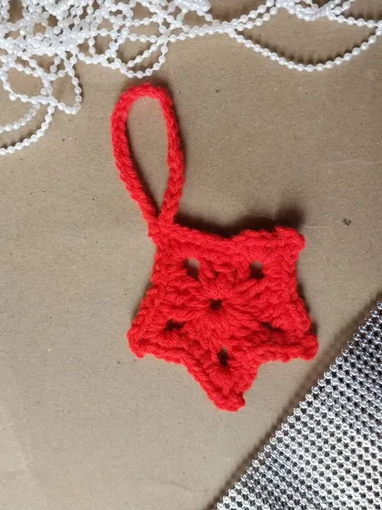 A classic red star ornament for your Christmas tree.