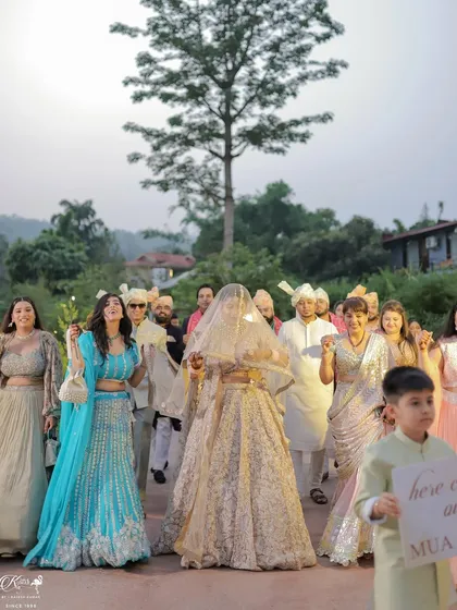 The bride's grand entrance, surrounded by her cheering family and friends. We capture the energy and emotion of this pivotal moment from multiple angles to tell the full story.