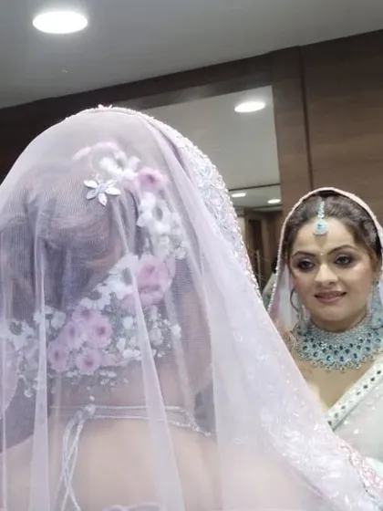 Another angle showing the placement of the flowers and the veil. The hairstyle is designed to be beautiful from every viewpoint.