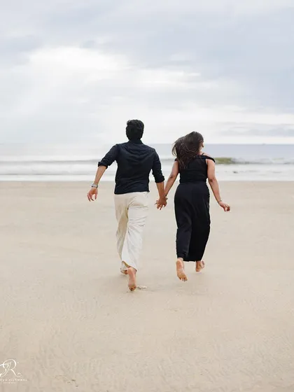Running towards the ocean together, hand in hand. This photograph symbolizes their journey forward together, captured during their beautiful Goa pre-wedding shoot.