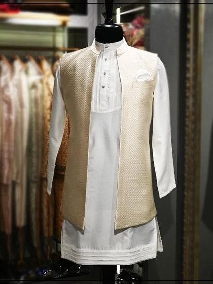 A full view of the off-white kurta with a matching textured Nehru jacket, a timeless and elegant choice.