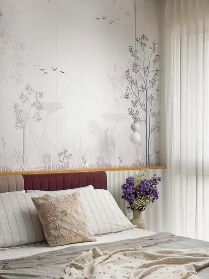 The headboard in this guest room is set against a delicate pastel wallpaper depicting a serene landscape. The contrasting deep red of the headboard adds a soft touch of color and character.