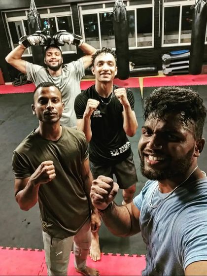 We aim for perfection, even if we never achieve it. The team looking strong and motivated after a boxing session.