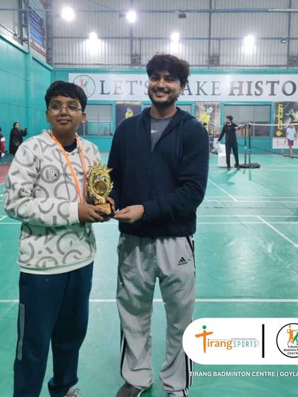 A proud winner from the Shuttle Shufflers tournament.