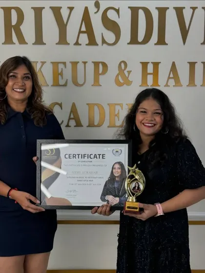 A moment of achievement. This student is now a certified makeup and hair artist.