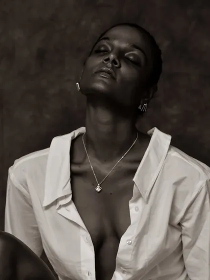 An eyes-closed, serene moment captured in beautiful monochrome tones.